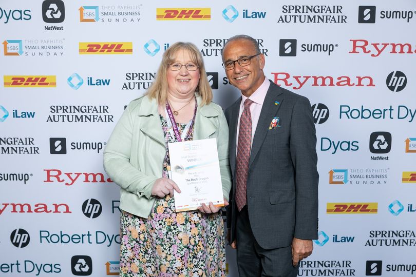 Two people at an award's ceremony because of a Book Shop in Stockton-on-Tees